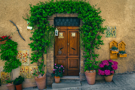 Entrance decorated with flowers, an Architecture Photo by Alpine Dreams