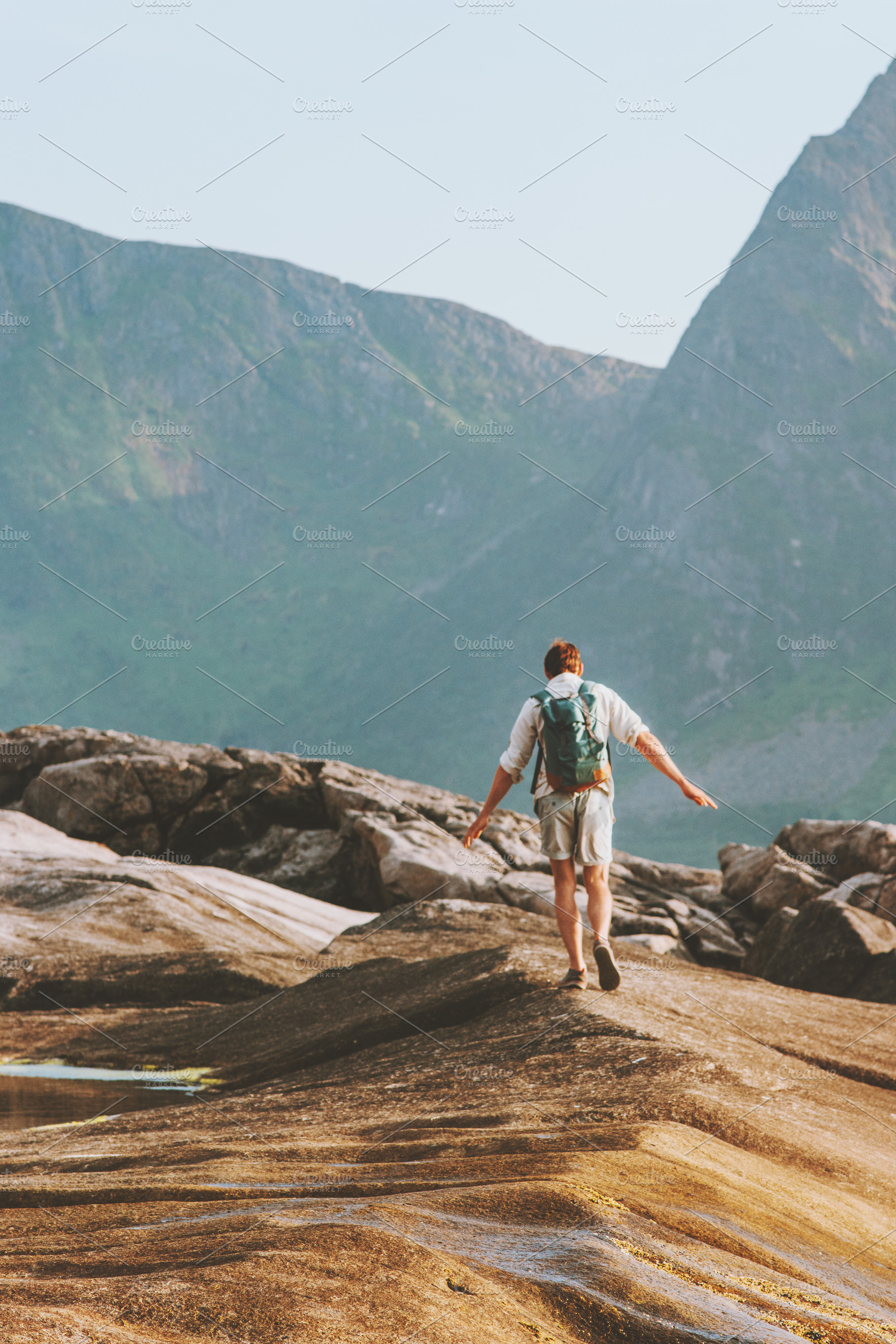 Man backpacker hiking in Norway summ, a Person Photo by e v e r s t