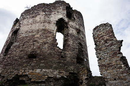 Historic stone ruins of an ancient castle with dramatic sky in Buchach, Ukraine, a Photo by AS photostudio