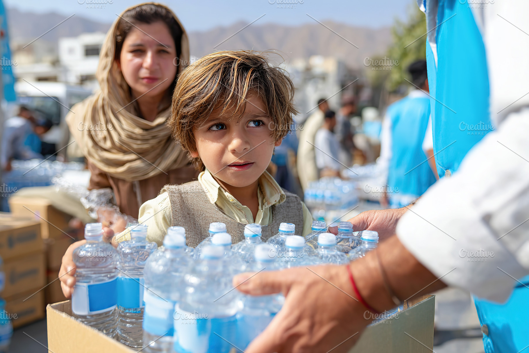 Child helps in water distribution during humanitarian effort in a local communi, a Photo by AlyaAnd