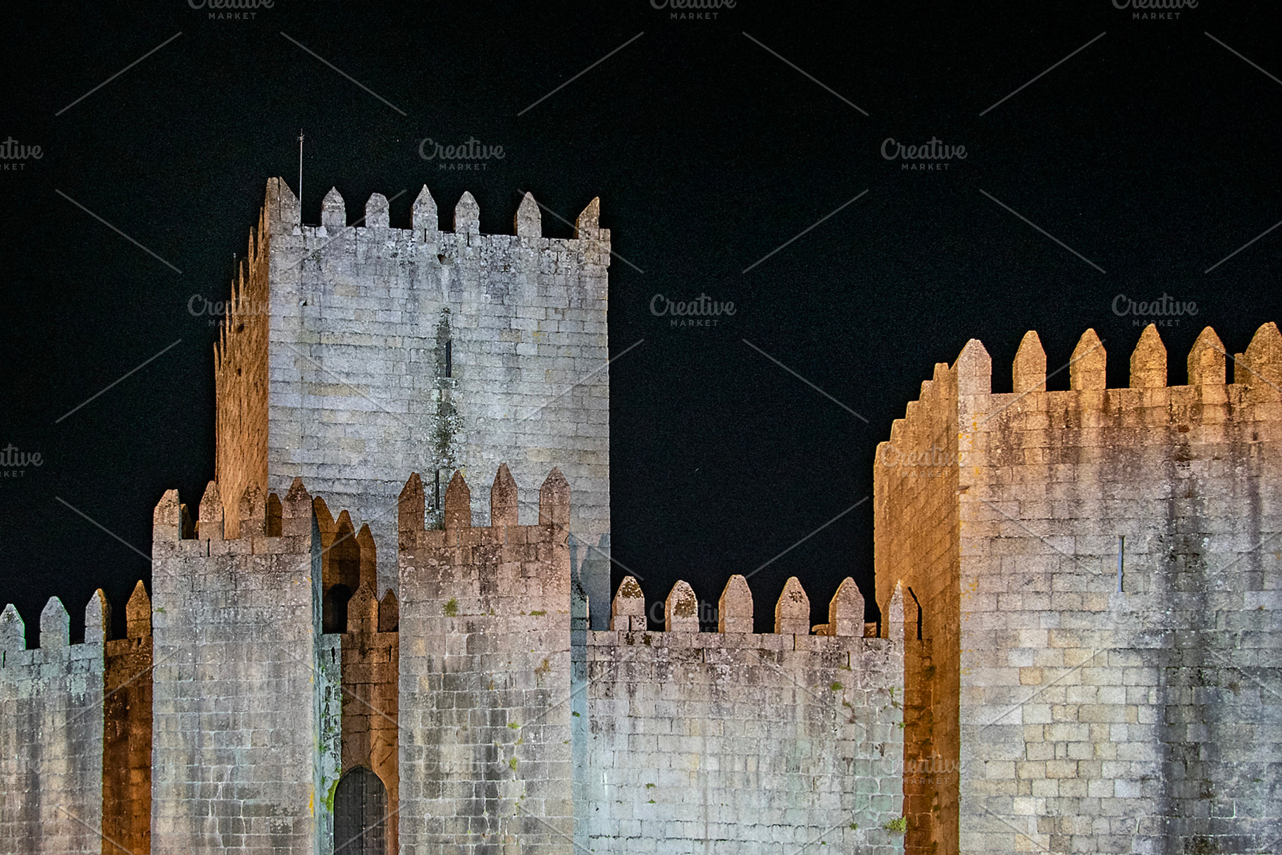 Guimaraes medieval castle exterior view, portugal, a Photo by DanFLCreativo