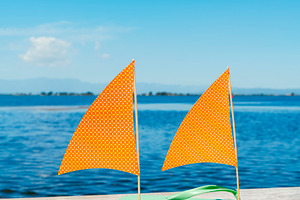 flip-flop sailboats beneath a wide blue sky, a Photo by Nito
