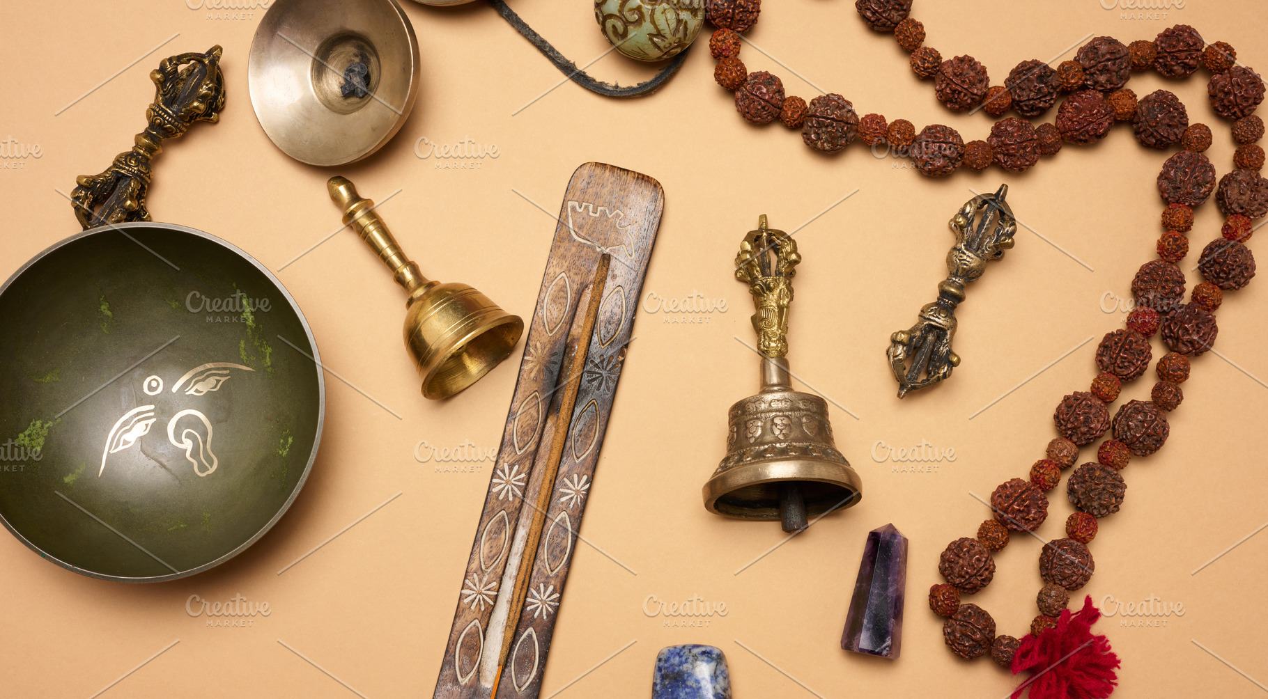 Tibetan singing copper bowl with a wooden clapper on a brown bac, a Background Photo by ndanko