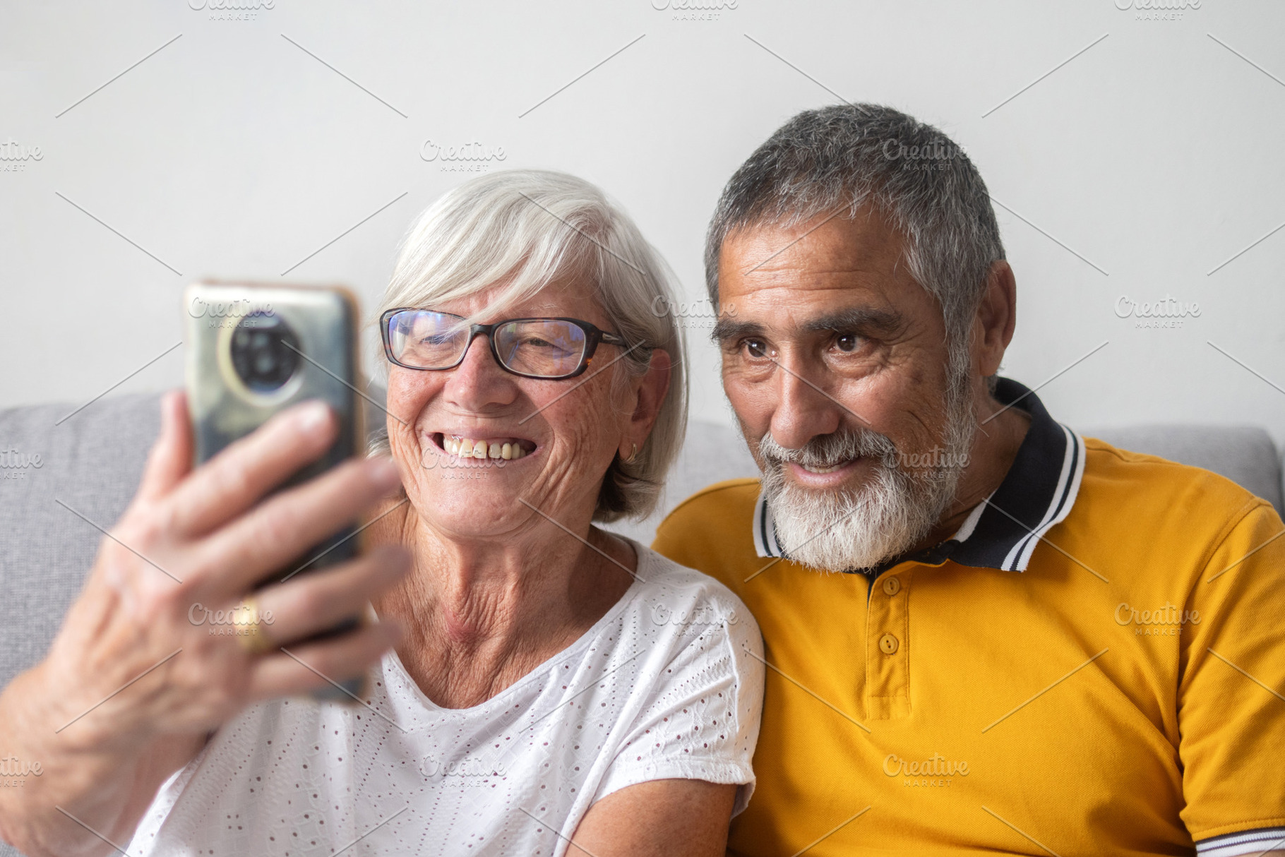 Senior couple taking selfie with smartphone, a Person Photo by etorres69
