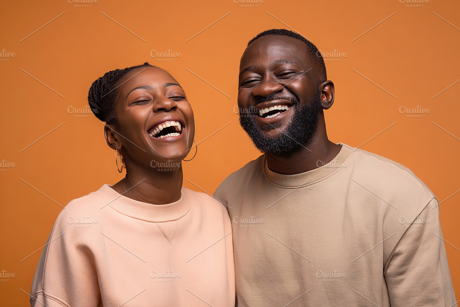 Smiling couple enjoying joyful moment together against orange backdrop, a Photo by AlyaAnd