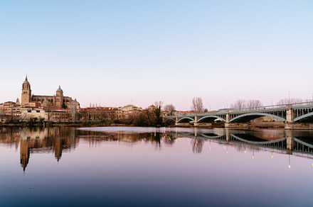 Scenic view of Salamanca with the Cathedral and iron bridge reflected in the To, an Architecture Photo by Architect´s eye