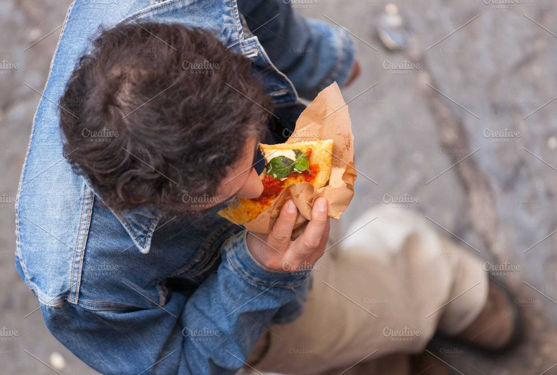 Man photographed from above eating a, a Photo by Antonio Gravante Market