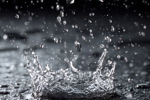 Water droplet splash dark background, a Photo by Pixeness Studio