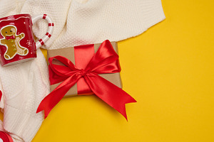 Christmas composition: two gift boxes with red bows, a mug and a, a Holiday Photo by ndanko