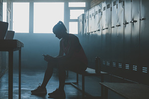 Female choosing music for workout