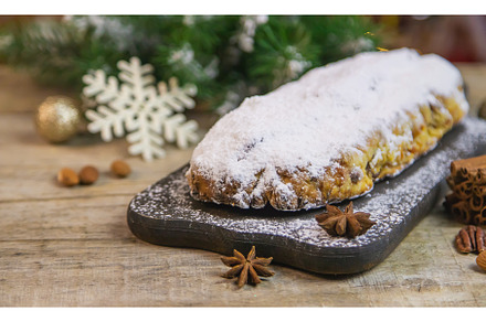 Stollen Christmas cake on the table, a Holiday Photo by yanadjana