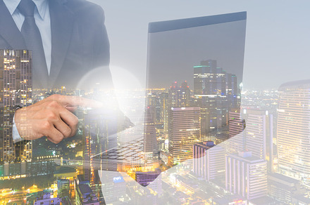 Businessman using the laptop, a Background Photo by Tzido Gallery