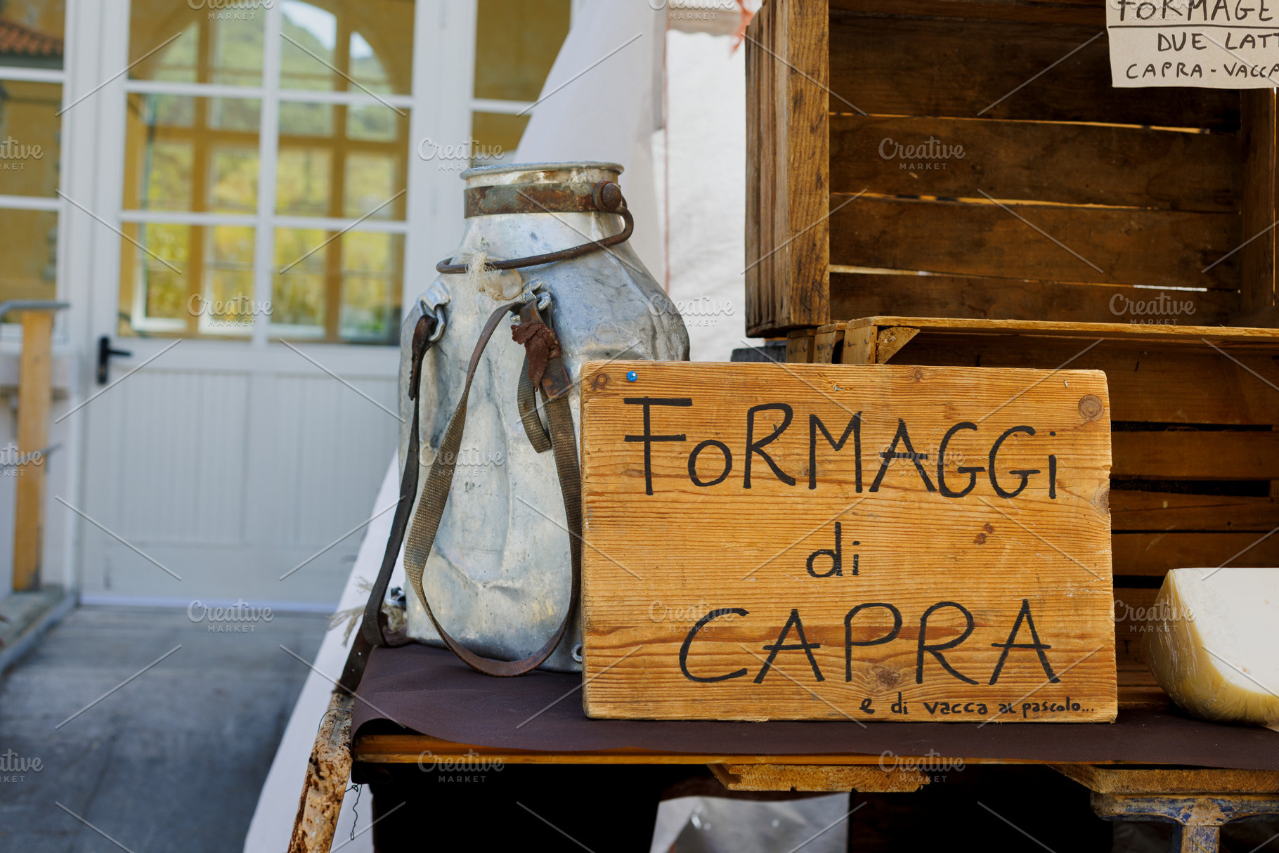 Wooden sign advertising goat cheese for sale, a Food & Drink Photo by Bepslabor