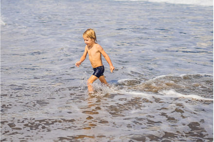 boy playing on the beach in the, a Person Photo by Elizaveta Galitskaya