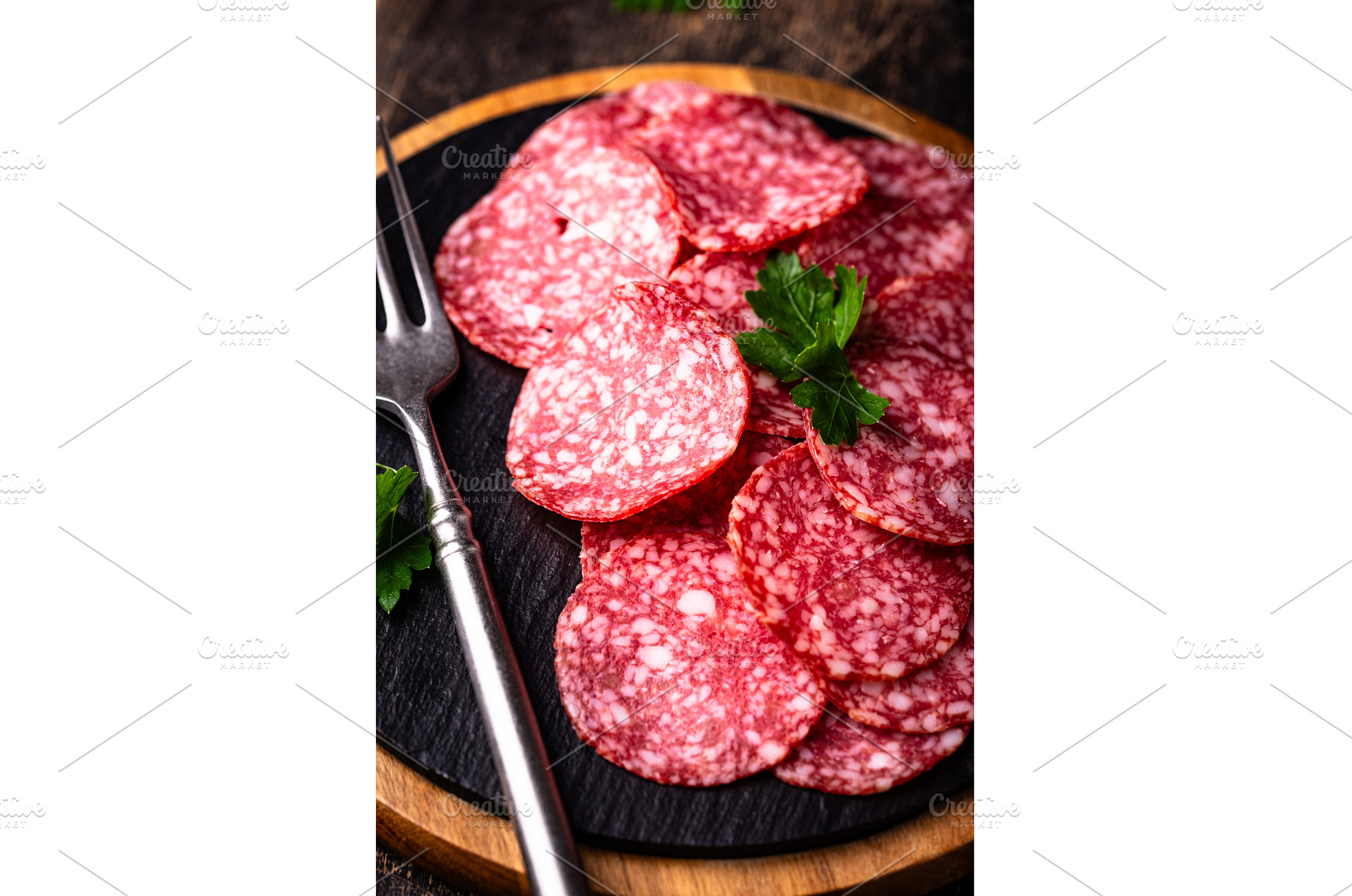 Sliced spicy tasty salami sausage, a Food & Drink Photo by Yulia Furman