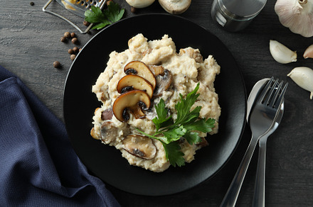 Concept of tasty food with risotto with mushrooms, top view, a Food & Drink Photo by AtlasStudio PRO