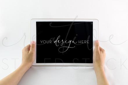 iPad Mockup with Child's Hands