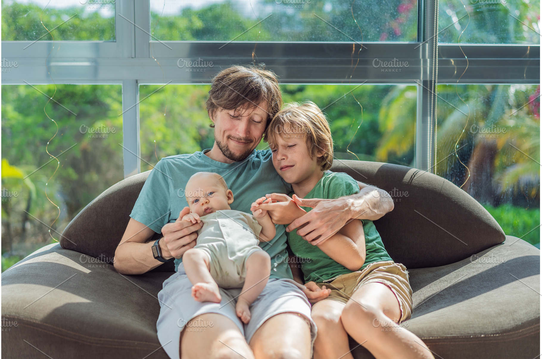Father, son, and newborn baby, a Person Photo by Elizaveta Galitskaya