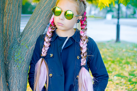 blonde girl wearing a sunglasses  with pink kanekalon in hair in, a Person Photo by vimart