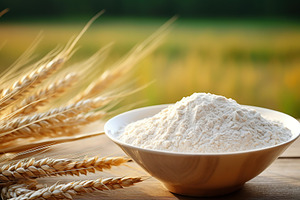Flour in wooden bowl with wheat ears on field background, a Food & Drink Photo by AlyaAnd