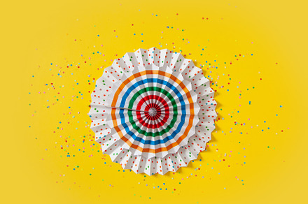 Colorful paper rosette and birthday garlands. Decorating for a p, a Beauty & Fashion Photo by Natalia Kostikova