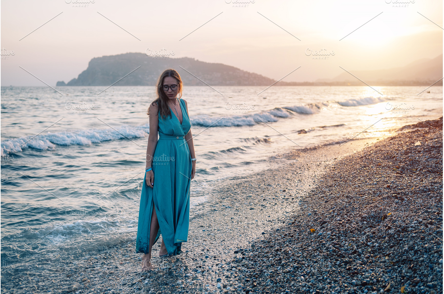 Woman in Flowing Dress on Seaside, a Person Photo by Jan Jack Russo Media