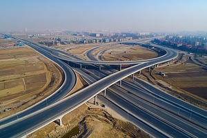 Top view photo of multilevel bridge highway road, an Industrial Photo by AlyaAnd