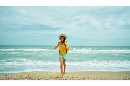 Happy carefree woman in hat running, a Person Photo by vitaliymateha photography