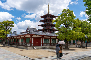 Women walking near pagoda at Shitenno-ji Temple in Osaka, Japan, an Architecture Photo by GoodGoods