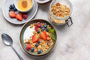 Granola bowl with yogurt berries and honey, a Food & Drink Photo by Olena Rudo