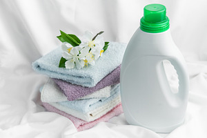 Fresh laundry concept with detergent and soft towels