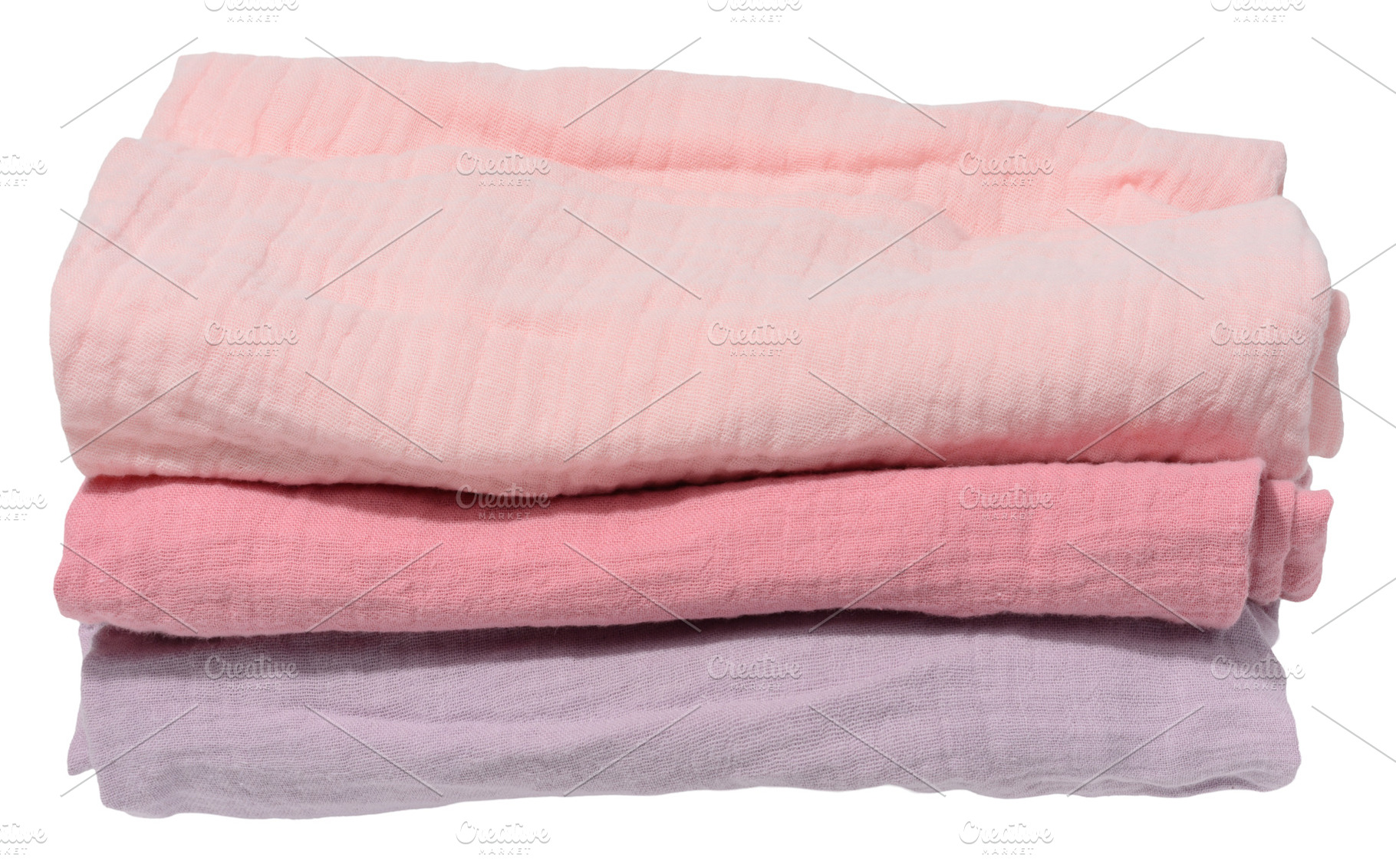 Stack of three folded cotton towels in pastel shades on isolated, a Technology Photo by ndanko