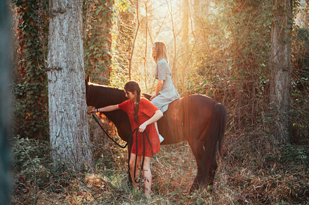 Two women friends chatting and stock photo containing women and ride, a Person Photo by Manu Reyes