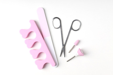 Concept of nail care with manicure accessories on white backgrou, a Beauty & Fashion Photo by AtlasStudio