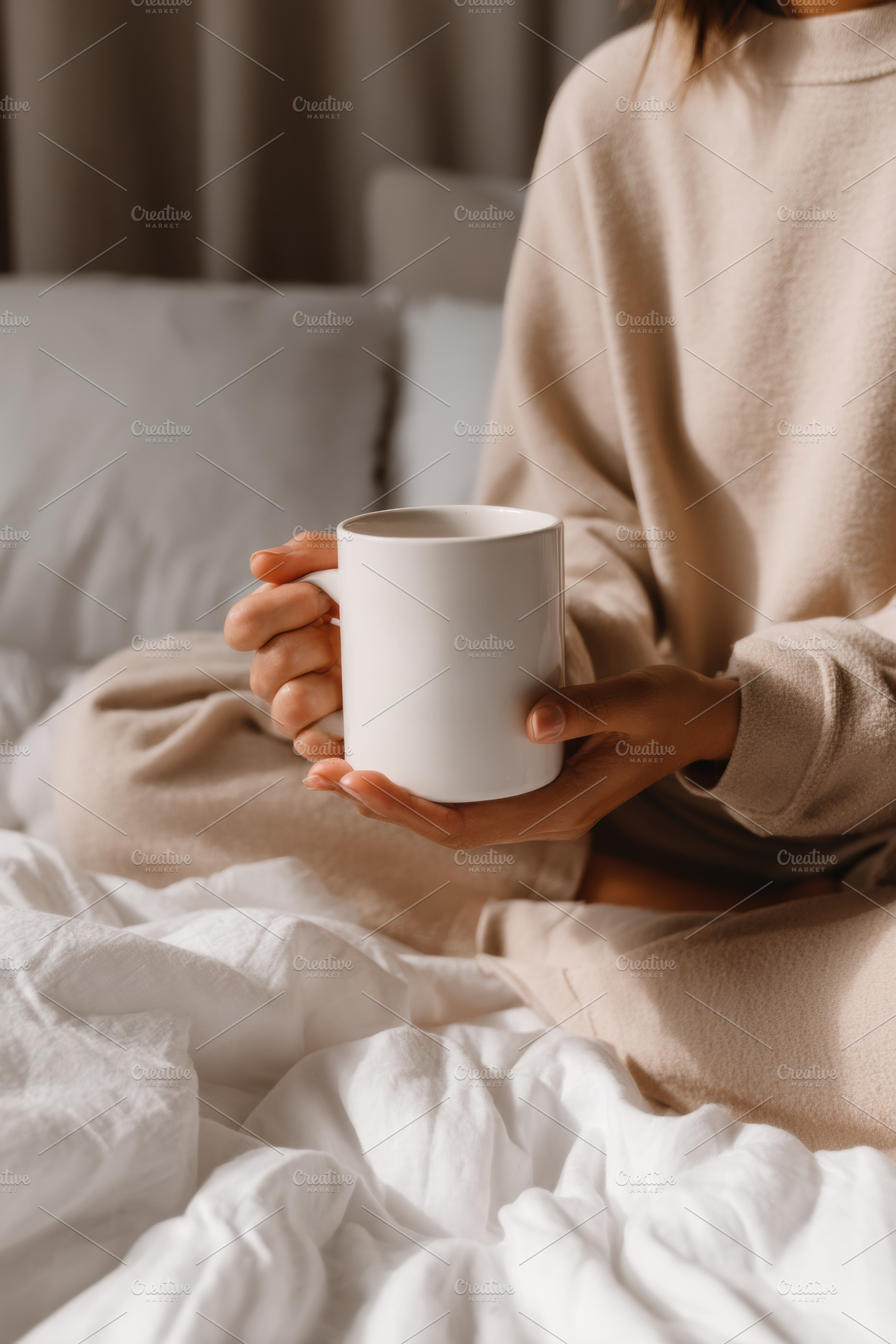 Woman holding cup on bed, a Person Photo by Virgo Studio