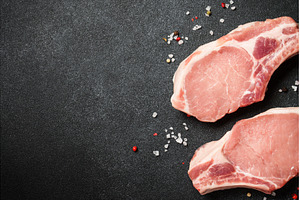Raw pork meat steaks on black, a Food & Drink Photo by Nadia-nb