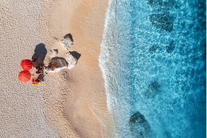 Aerial view of red umbrellas, sandy, a Nature Photo by den-belitsky