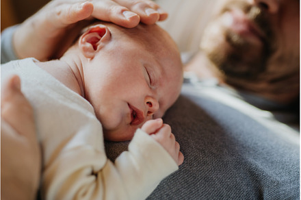 Close-up of father cudddling his, a Person Photo by HalfPoint