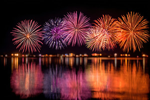 Colorful fireworks over a tranquil lake, a Holiday Photo by AlyaAnd