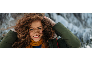 Woman enjoying winter time in snowy, a Person Photo by HalfPoint