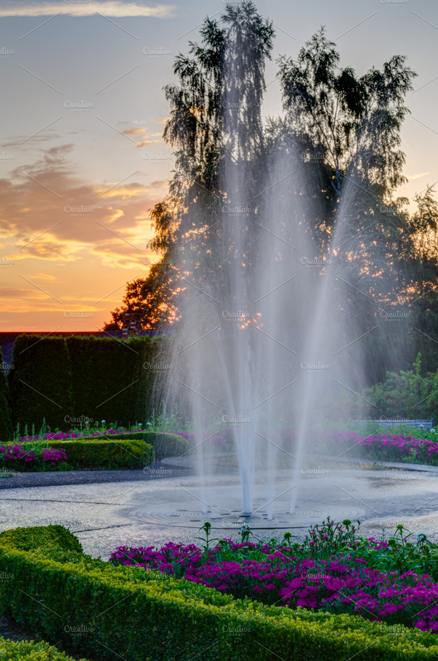 Water Fountain With Sunset At A Park