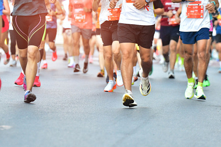 People Running On City Road.