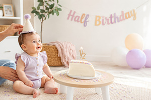 Baby celebrating half birthday with, a Photo by Dvoevnore photos