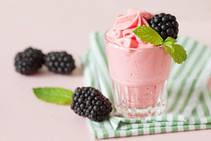 Raspberry ice cream containing cream, ice cream, and topping