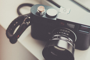 Camera containing wood, camera, and lens
