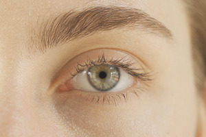Woman eyes and face. Close-up of blonde caucasian girl. Texture