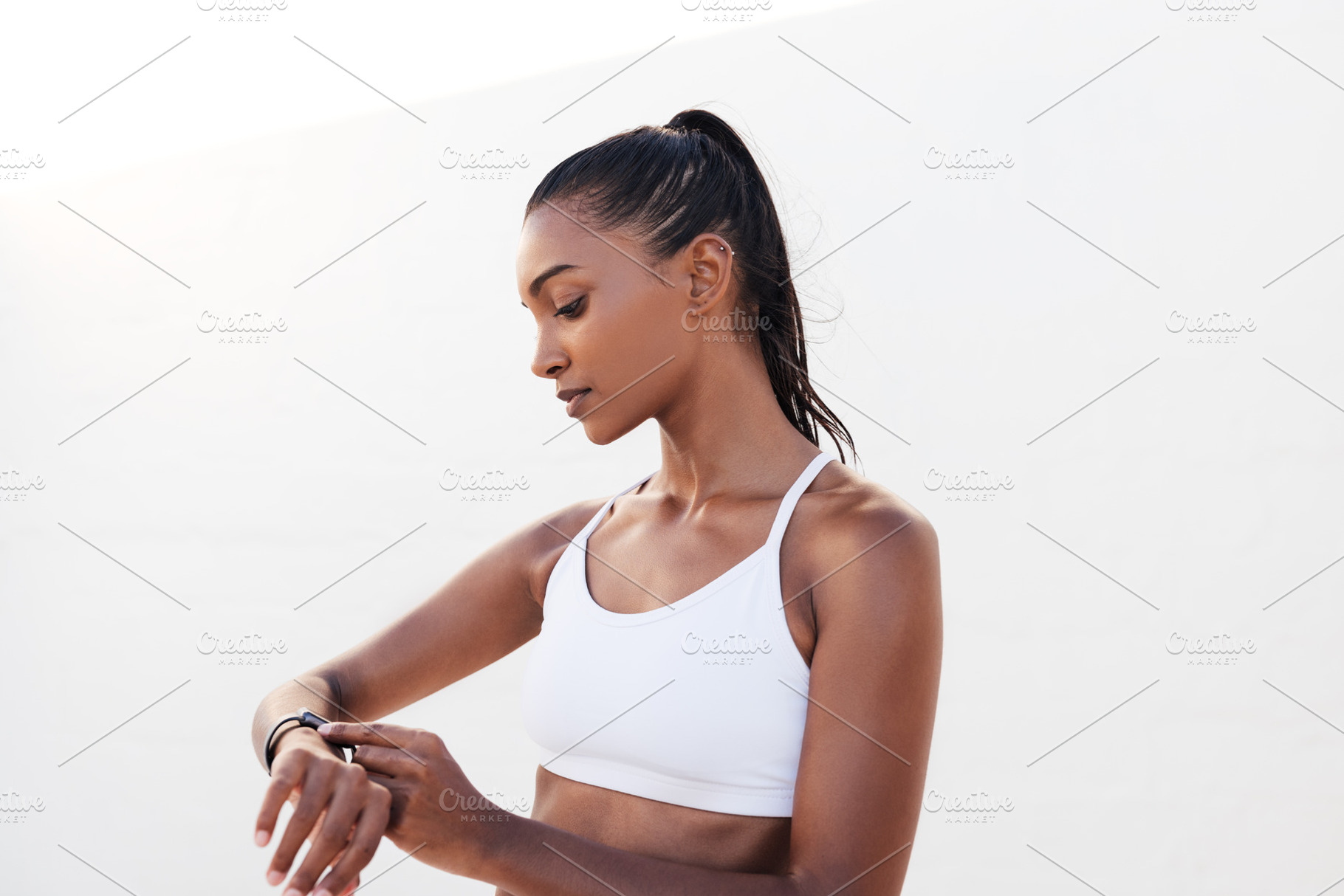 Fitness female with smart watch, a Sports & Recreation Photo by Artem Varnitsin