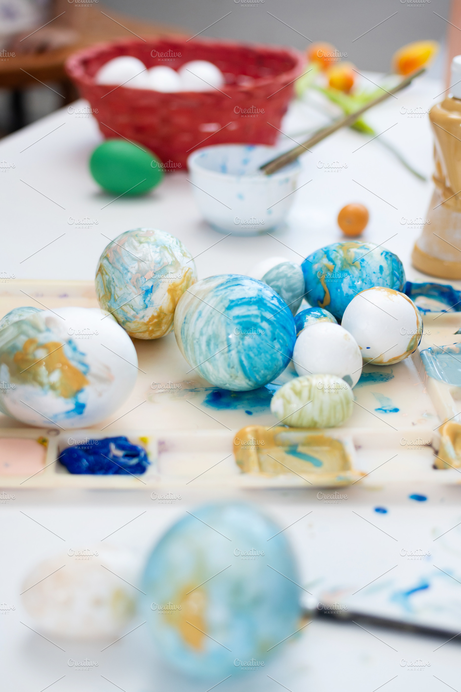 Painted Easter eggs on art palette, a Person Photo by etorres69
