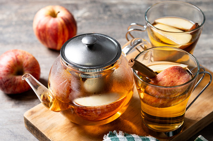 Hot apple drink with spices on wooden table, a Food & Drink Photo by etorres69