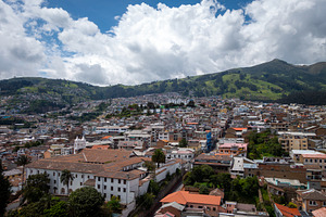 Aerial view of Quito city and surrounding hills in Ecuador, an Architecture Photo by GoodGoods